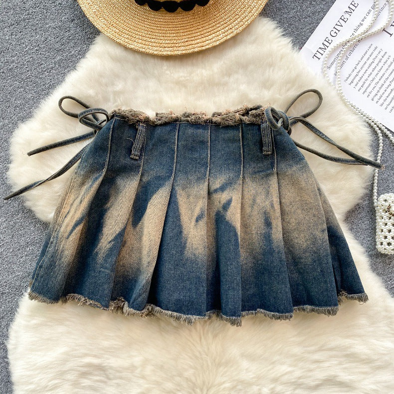 Aurielle Watercolor Pleated Mini Skirt – Signature Bow Detail