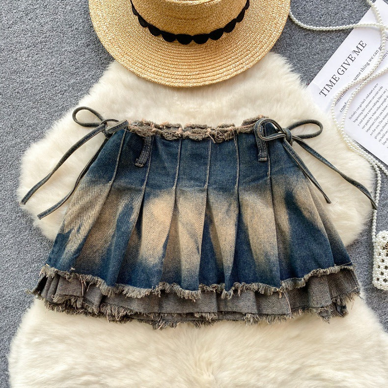 Aurielle Watercolor Pleated Mini Skirt – Signature Bow Detail